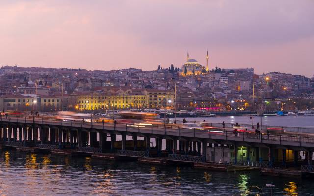 Istabul Bridges featuring the Atatürk Bridge at dusk with a purple sky