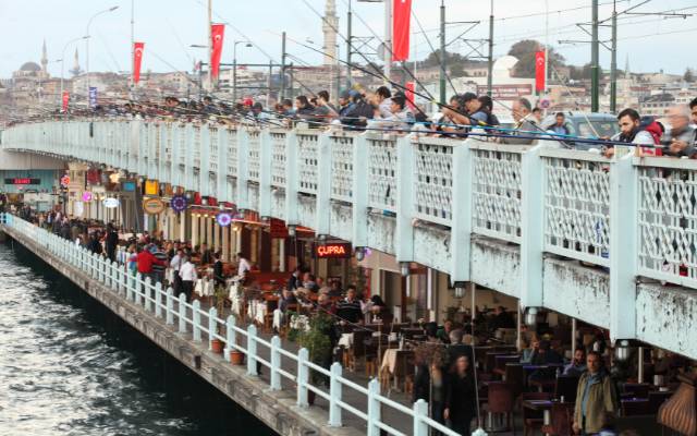 Istanbul bridges Galata Bridge covered in fisherman and showing the restaurants beneath